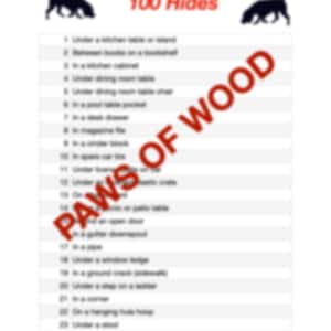 May include: A white list with the title "100 Hides" in red, featuring a list of hiding places. The words "PAWS OF WOOD" are stamped across the list in red. Two black dog silhouettes are at the top.