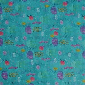 May include: A turquoise fabric with a repeating pattern of purple jellyfish, pink and yellow sea creatures, and gold seaweed. The fabric has a subtle watercolor effect.