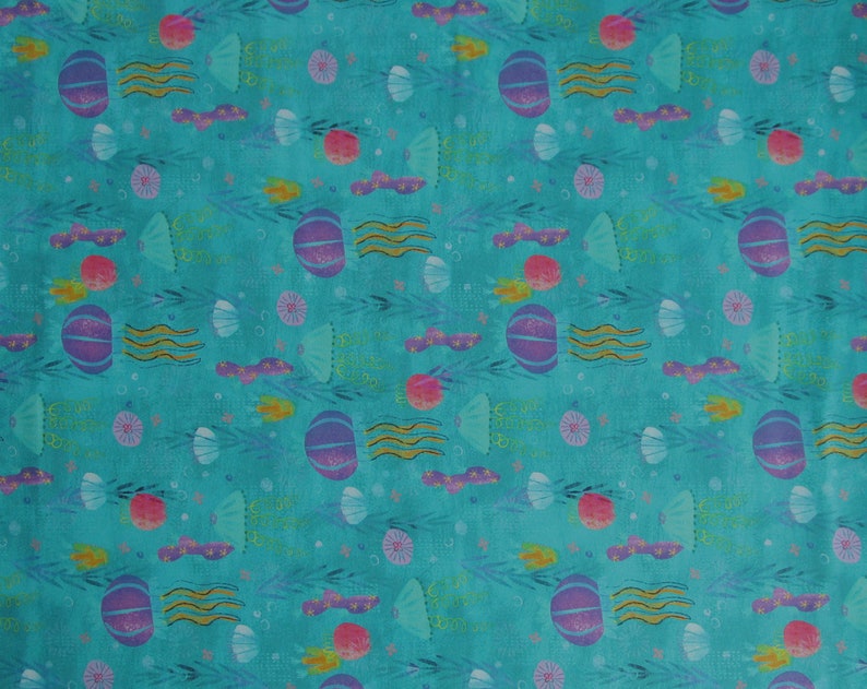May include: A turquoise fabric with a repeating pattern of purple jellyfish, pink and yellow sea creatures, and gold seaweed. The fabric has a subtle watercolor effect.
