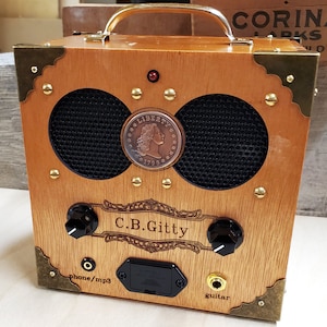 L’amplificateur cigar box « Copper Cent » - vintage Coin, Classic Look, Awesome Sound - Double entrée pour guitares et smartphones!