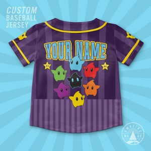 May include: A purple baseball jersey with vertical stripes, yellow trim, and the text YOUR NAME in light blue. The back features a graphic of seven colorful star-shaped characters in blue, green, red, orange, yellow, purple, and black.