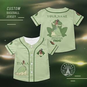 May include: Light green baseball jersey with a white collar and button-up front. The jersey features a cartoon image of a princess and the text "YOUR NAME" on the back. The front of the jersey has the text "TIANA" and a diamond-shaped image of the princess.