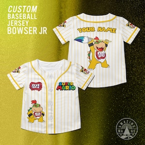 May include: Two white baseball jerseys with yellow pinstripes and trim. One jersey has "YOUR NAME" on the back and a Bowser Jr. graphic. The other has a "Super Mario" logo and a Bowser Jr. graphic. Text on the left says "CUSTOM BASEBALL JERSEY BOWSER JR."