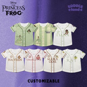 May include: A selection of customizable baseball jerseys featuring characters from Disney's "The Princess and the Frog." Jerseys in green and white with character names and illustrations. The text "CUSTOMIZABLE" is at the bottom.