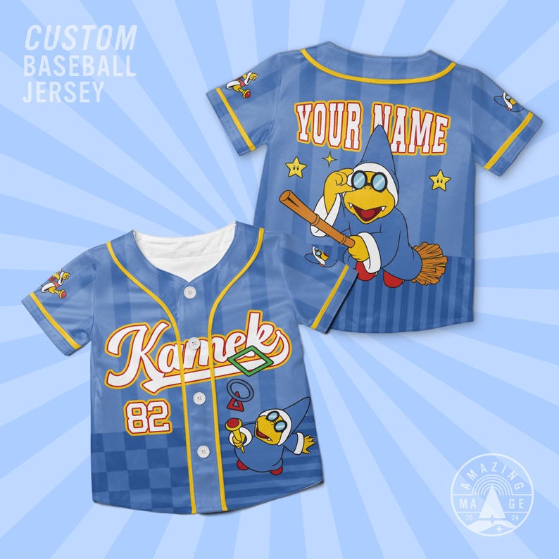 May include: A light blue baseball jersey with a checkered pattern, featuring the text Kamek and the number 82 on the front. The back displays the text YOUR NAME above a graphic of a character in a blue robe holding a broomstick and stars.