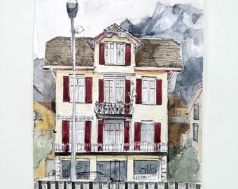 May include: Watercolor painting of a yellow building with red shutters and a balcony. The building is in front of a fence and a mountain range in the background.