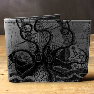 May include: A black leather wallet with a graphic print of a kraken attacking a ship. The kraken is a mythical sea monster with tentacles.