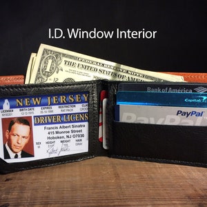 May include: Open black leather wallet with a brown accent, holding a New Jersey driver's license, cash, and credit cards. The license features a photo of Francis Albert Sinatra. The text "I.D. Window Interior" is at the top.