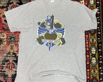 Camiseta gris de la gira mundial de Bon Jovi, talla XL.