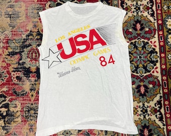 Camiseta sin mangas vintage de los Juegos Olímpicos de EE. UU. de 1984 en Los Ángeles, color blanco con estampado, talla M.