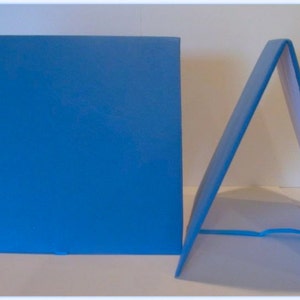 May include: Two blue foam display boards. One board is flat and the other is folded into a triangular shape.