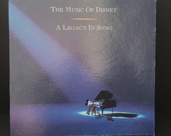 The Music of Disney: A Legacy in Song/3 disc set of Disney music/songs from 1928 - 1991/classic movie songs/Collector book included/USA