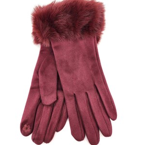 May include: A pair of burgundy suede gloves with a faux fur cuff. The gloves have a simple design and are perfect for keeping your hands warm in the winter.