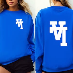 May include: A royal blue sweatshirt with a white "LA" logo on the front and back.