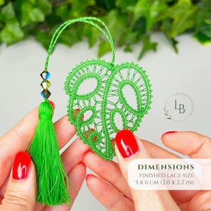 May include: A bright green lace monstera leaf ornament featuring a matching tassel and three iridescent beads on a string. The finished lace size is 5 x 6 cm (2.0 x 2.2 in). A circular logo with the text LACYBOTANICS.COM is visible on the right.