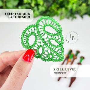 May include: A bright green freestanding lace design shaped like a leaf with intricate openwork patterns. The text on the image reads Freestanding Lace Design and Skill Level Beginner. A logo with the letters LB is visible on the right side.