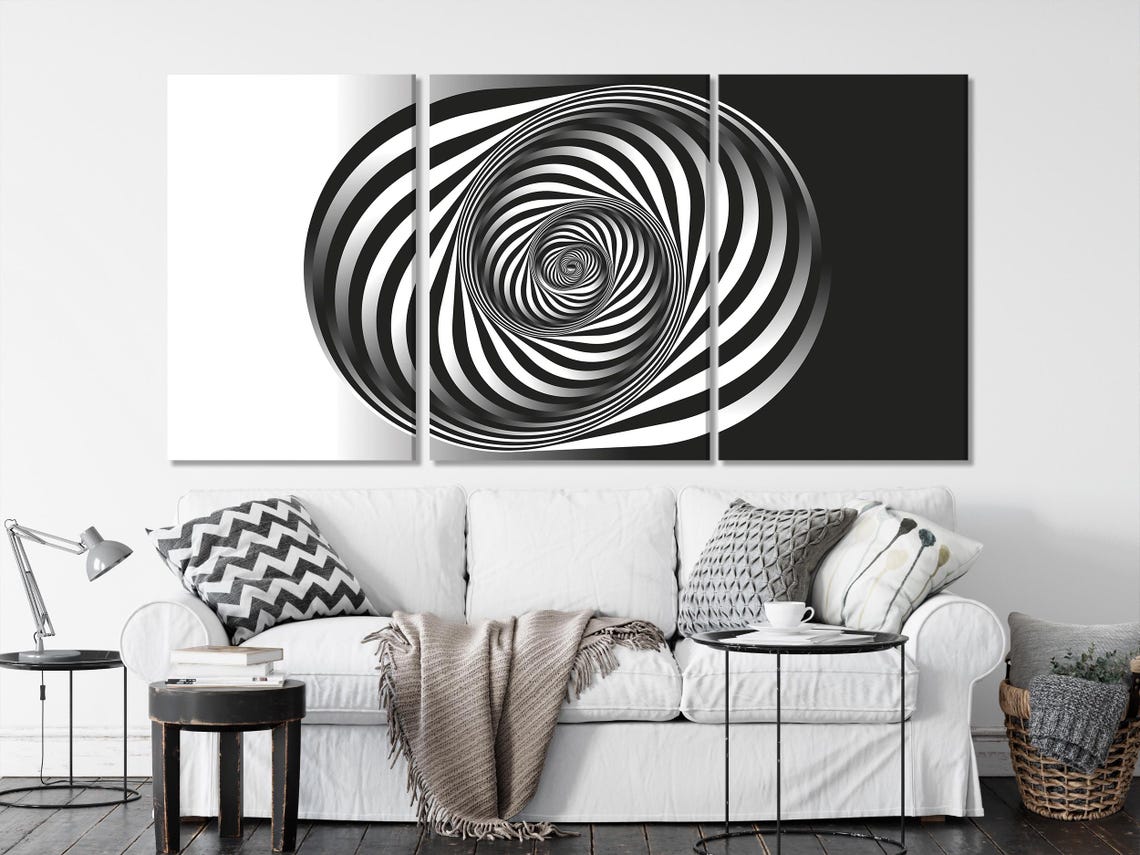 A monochrome spiral of tightly curving white and black bands draws inward to a small central swirl, creating an optical illusion effect detail view