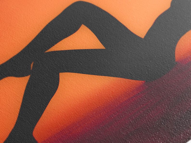 Canvas print featuring a stylized silhouette of a person's legs against a vibrant orange-to-burgundy gradient background. The silhouette is dark charcoal gray, providing a striking contrast to the warm hues of the backdrop. The texture of the canvas is subtly visible, adding depth to the artwork.  The image is a modern, abstract depiction, suitable for contemporary home decor or art collections. The artwork uses a bold color palette and simple lines to create a visually appealing piece.