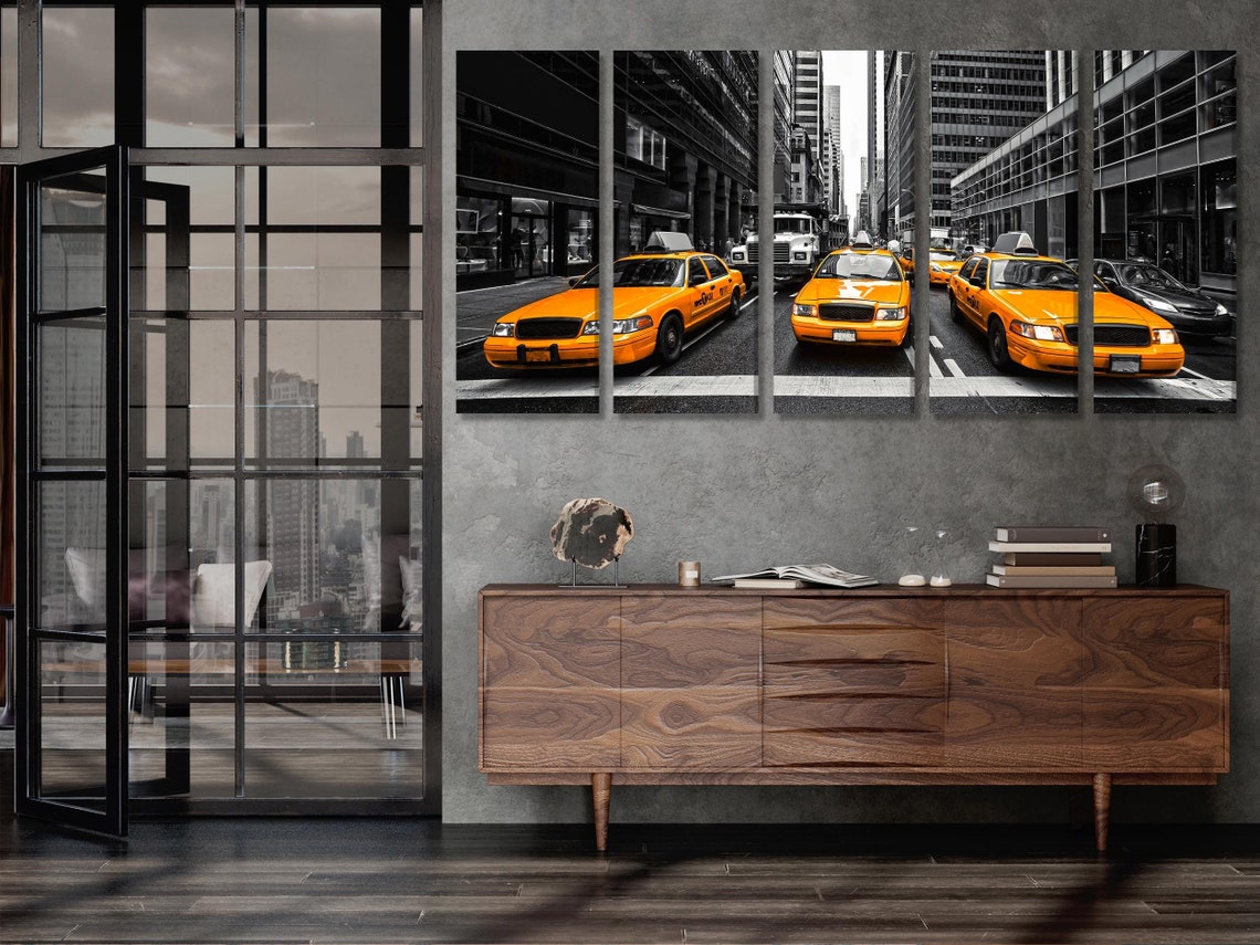 Room mockup with three-panel yellow taxi street artwork above a sofa