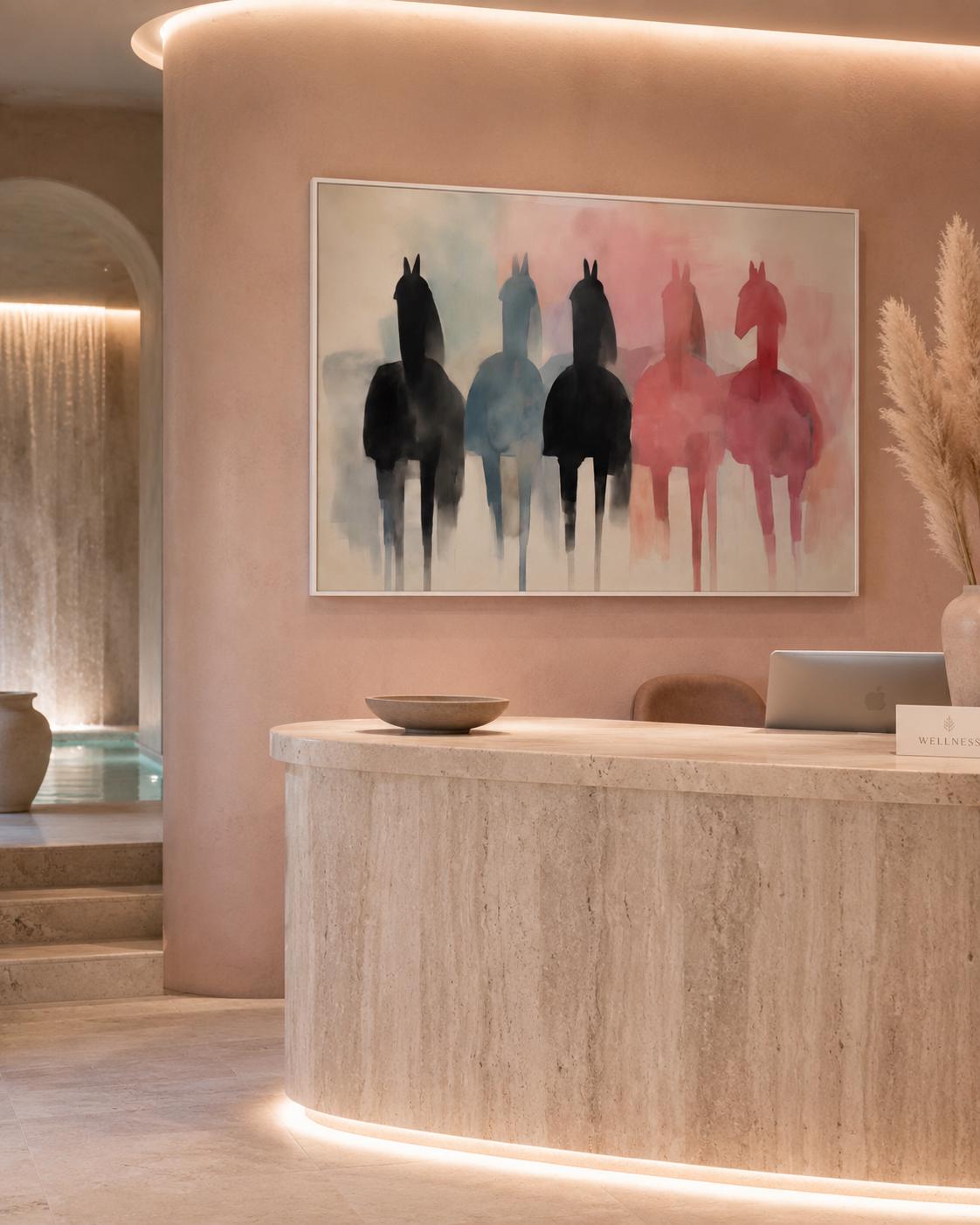 A person standing near a floor plant and a framed horse silhouette artwork on a wall