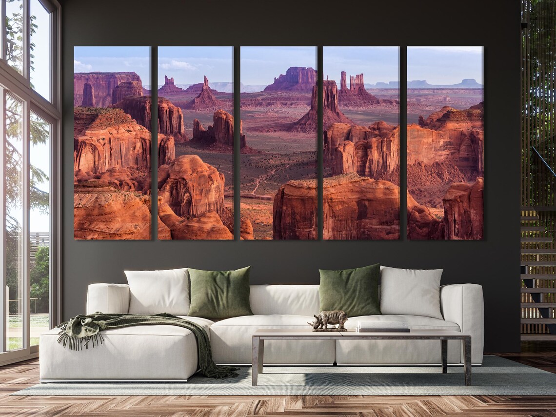 Desert canyon with red rock formations and pale blue sky detail view