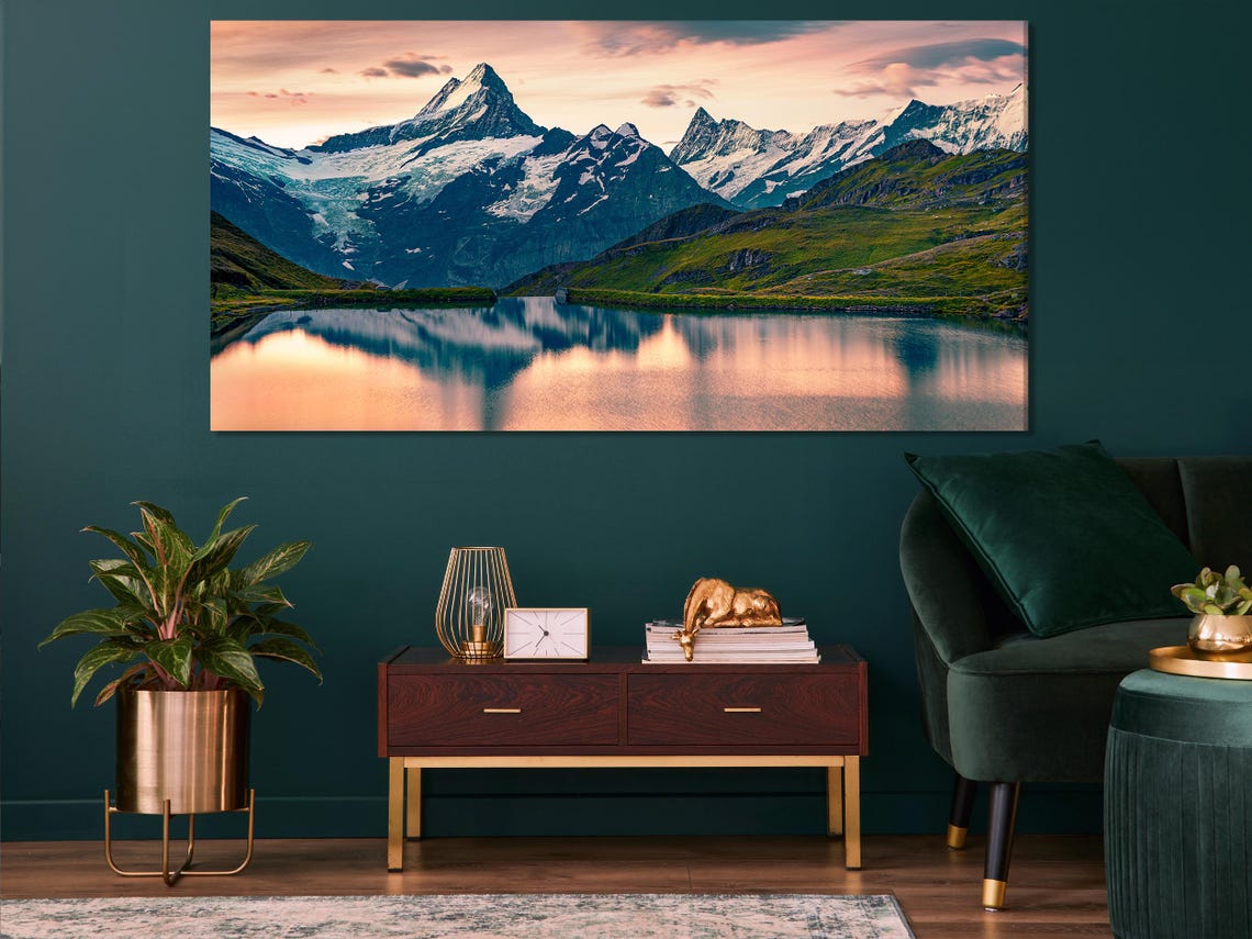 Mountain lake landscape with snowy peaks and sunrise sky in blue and blush pink detail view