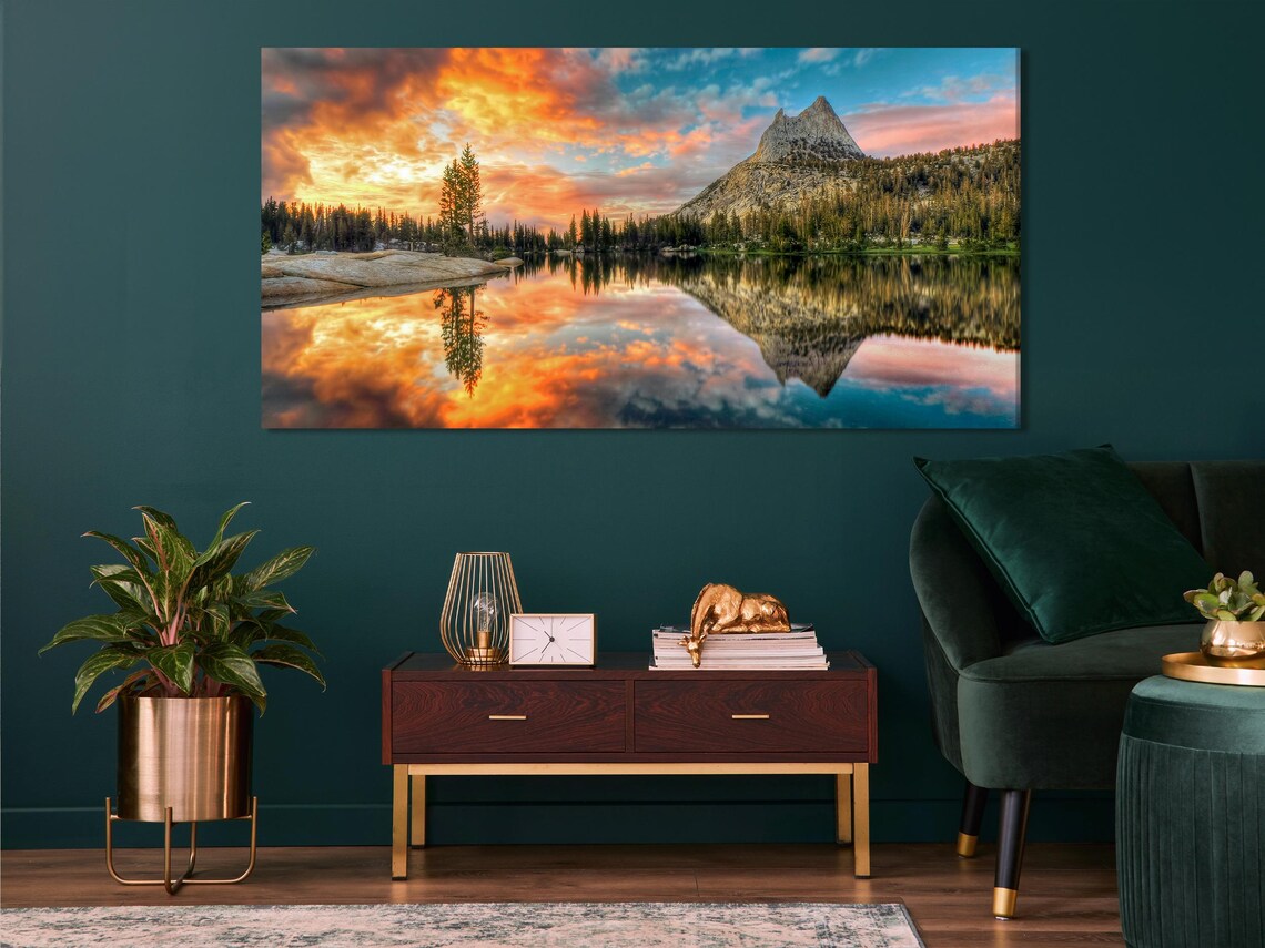 Living room with five framed landscape panels above a sofa