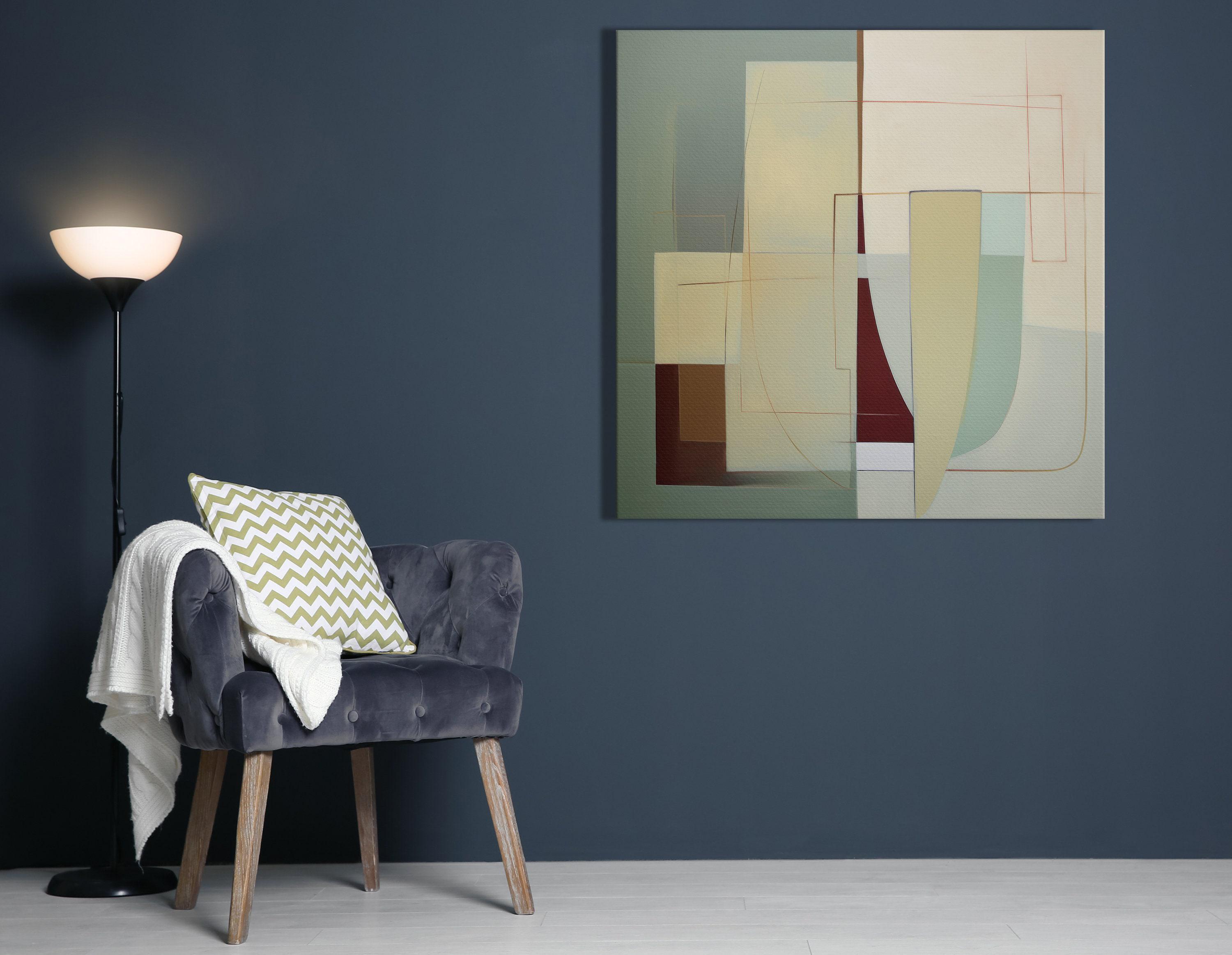 A framed abstract geometric composition combines muted sage and terracotta blocks with cream and burgundy lines in a balanced, mid-century style