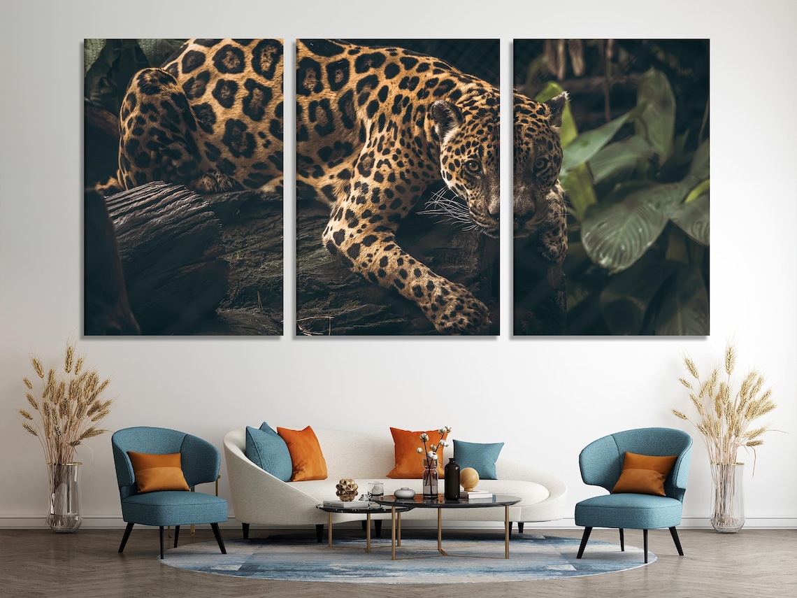 Room mockup with a dark green jungle jaguar artwork on a wall above a wooden sideboard