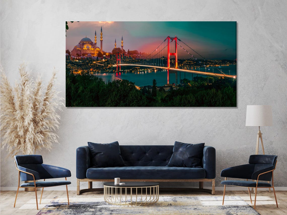 Room mockup with three-panel night cityscape artwork on a light brick wall above a dining table