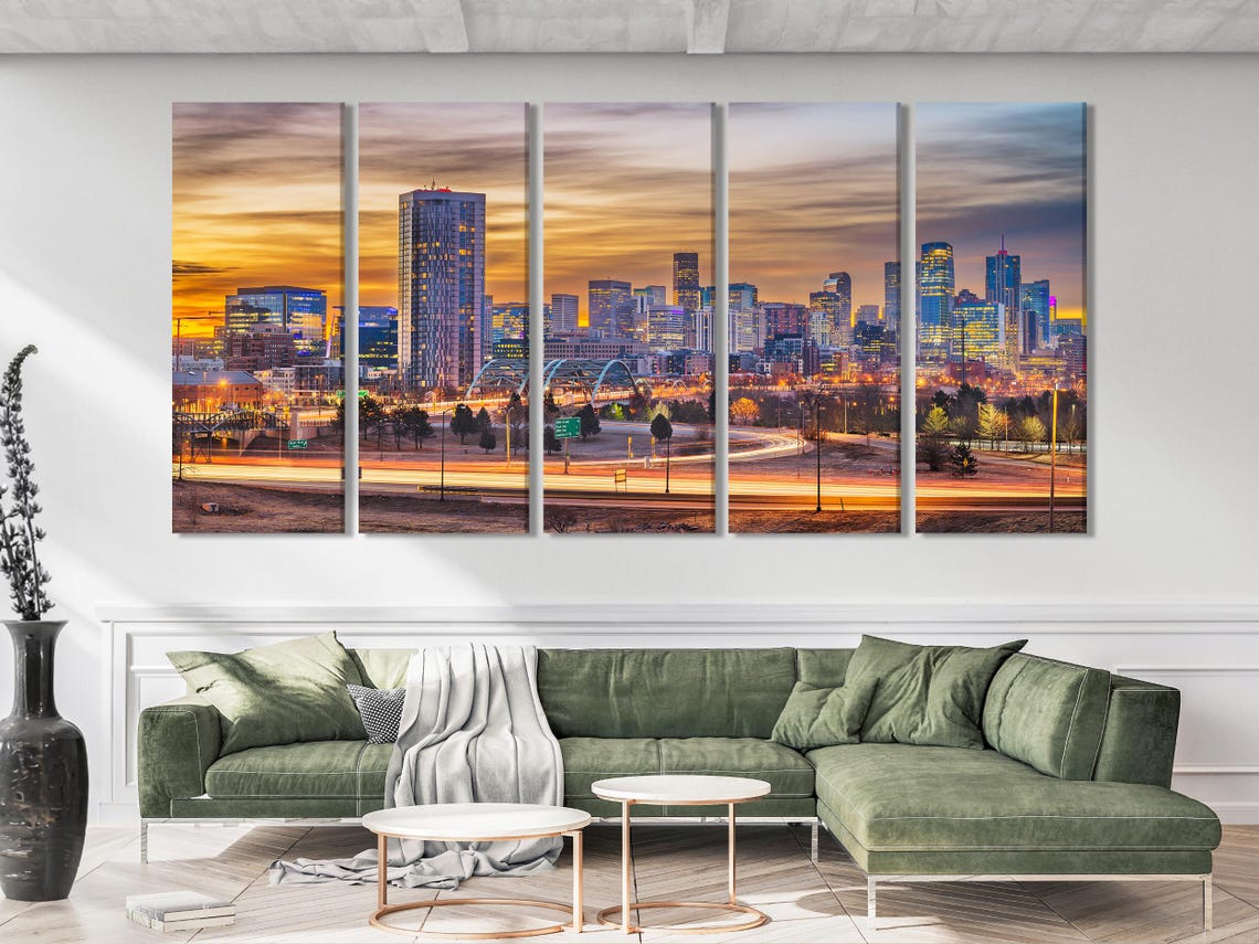 Room mockup showing a large framed city skyline print above a sofa