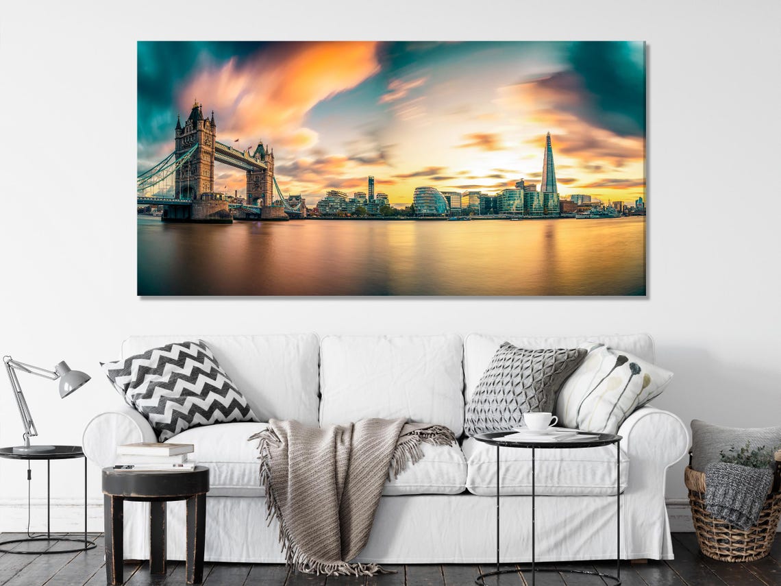 Three-panel city skyline at sunset with teal clouds and golden river reflections detail view