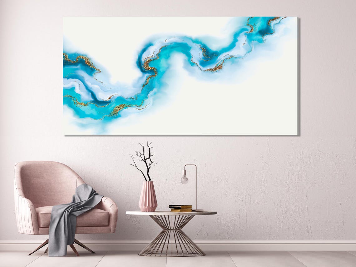 Living room mockup with three abstract blue-and-gold artworks above a sofa