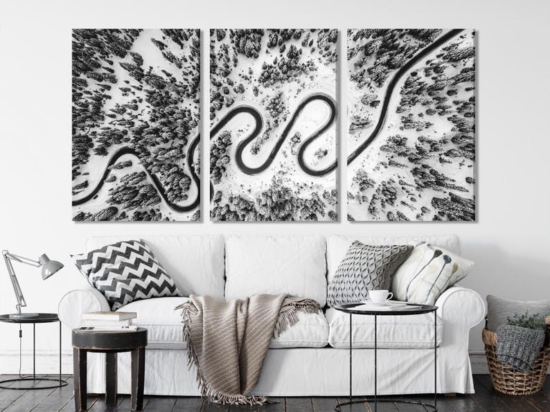 Three black-and-white aerial panels showing winding snowy roads through a forest