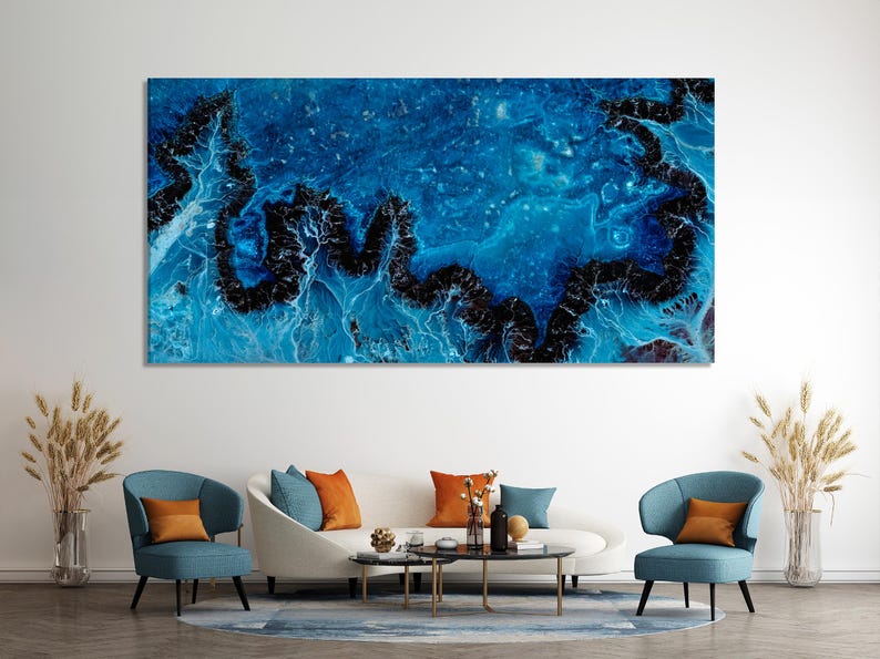 Deep blue abstract artwork with swirling teal currents and dark black fragments