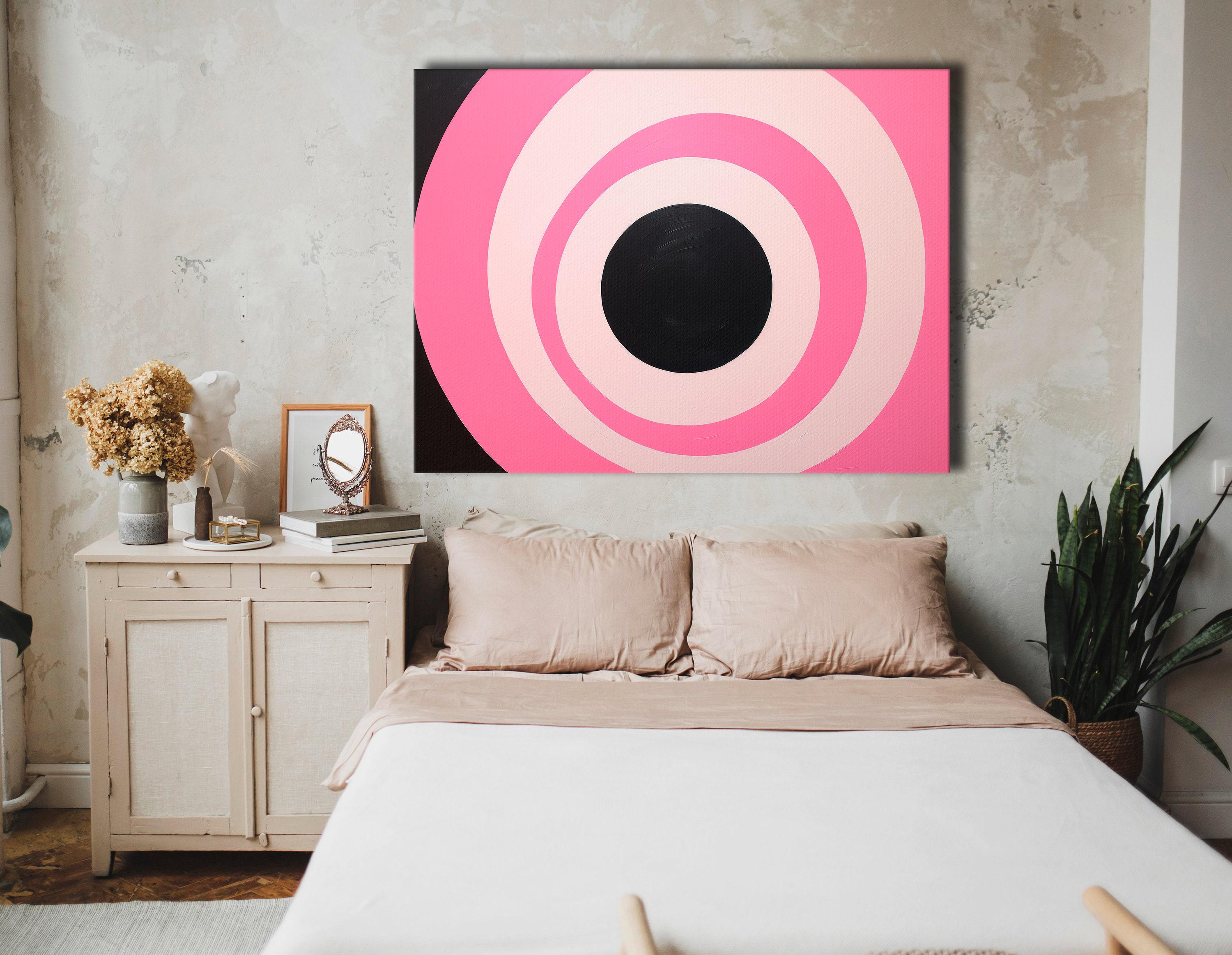 Hot pink and black concentric circles geometric artwork with pale ivory rings detail view