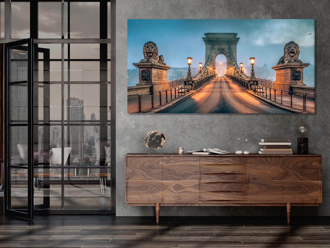 Three-panel misty bridge cityscape at dusk with warm lamps and lion sculptures on pillars detail view