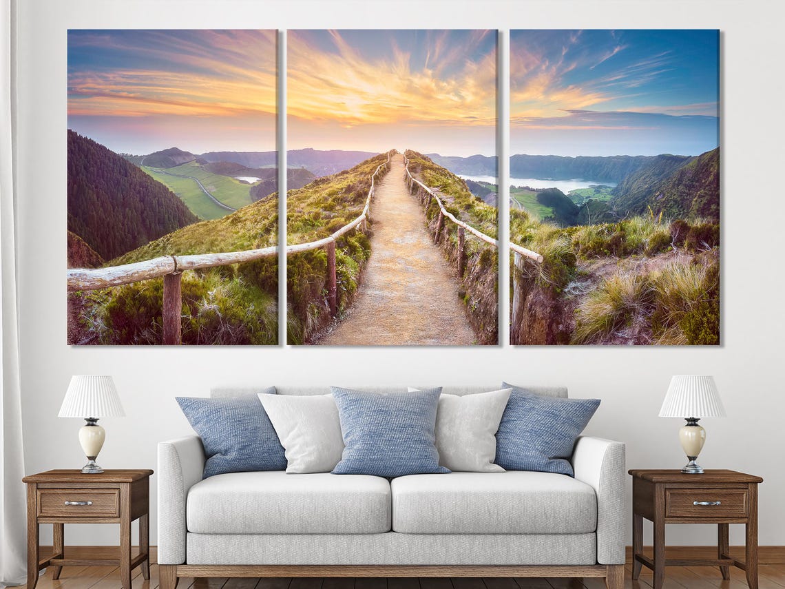 Room mockup with sofa and multi-panel landscape artwork above it