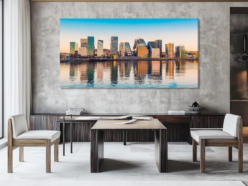 Colourful modern city skyline reflected in calm harbour water under a blue sky gradient