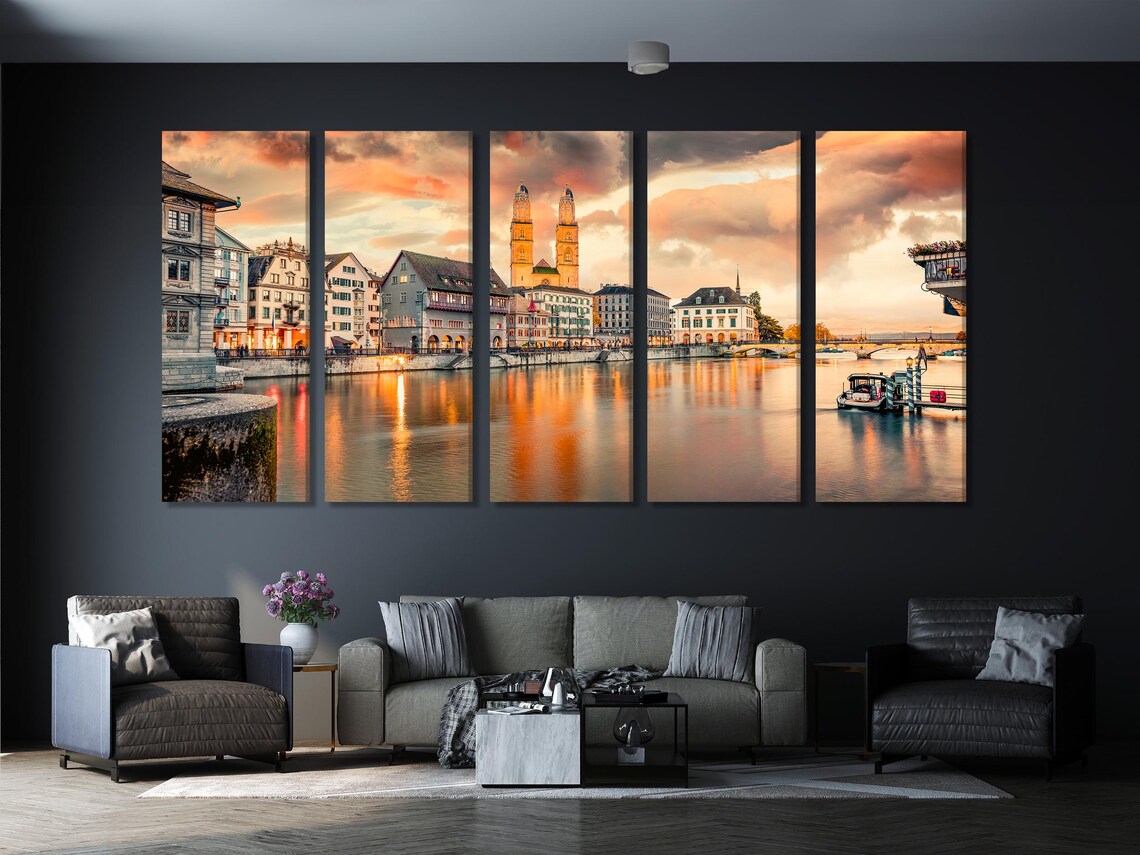 Dining area with wall-hung cityscape artwork featuring a twin-tower church at sunset