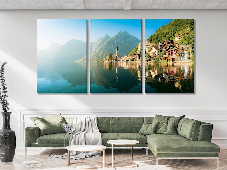 Three-panel mountain lake landscape with teal water reflections, alpine green hills and a lakeside village with a church spire