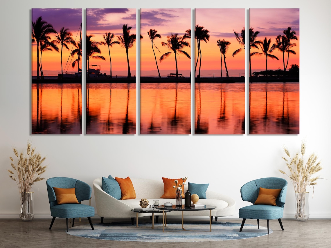 Room mockup with a framed sunset palm tree artwork above a dining table