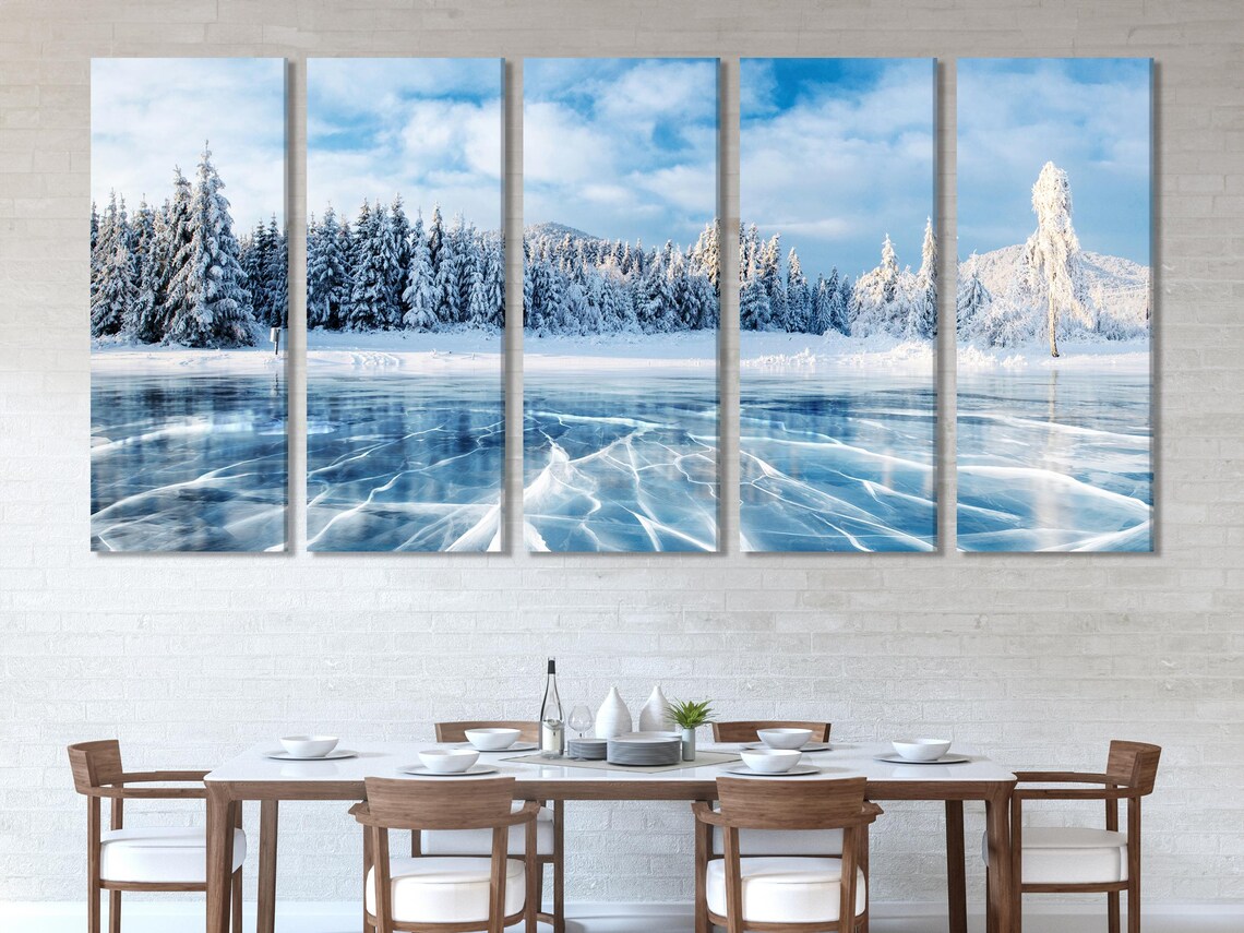 Room mockup showing a large winter frozen lake landscape artwork above a sofa