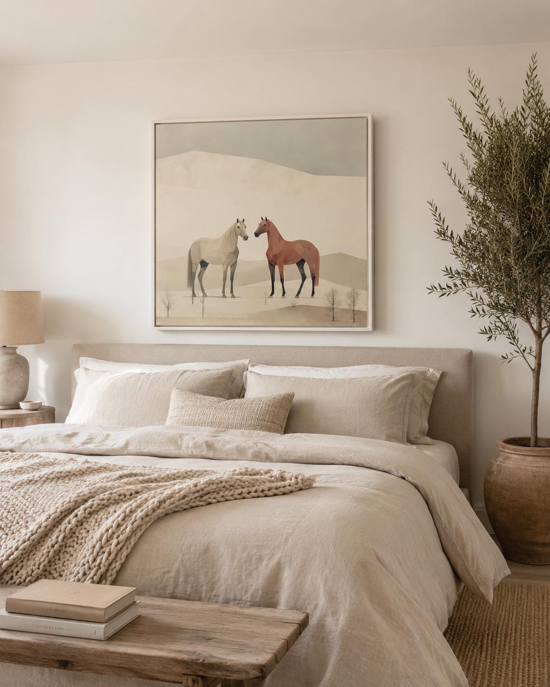 People holding wine near a framed minimalist desert horse artwork on a wall