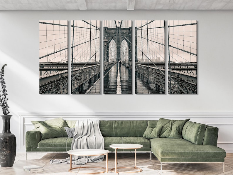 Black-and-white bridge scene across multiple vertical panels with suspension cables and lattice detail