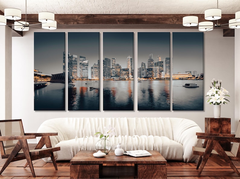 Five-panel night city skyline with glowing buildings and reflections in dark water