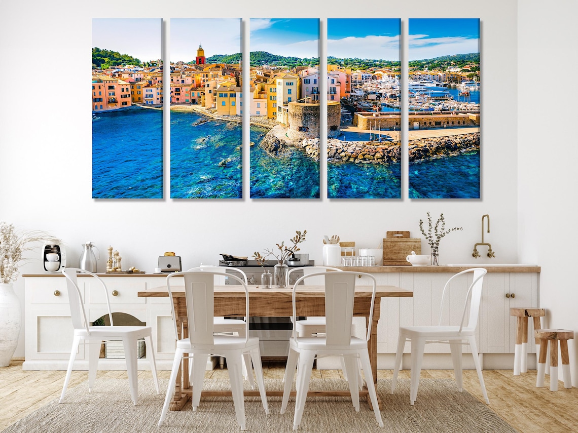 Room mockup showing a large harbour town artwork above a sofa