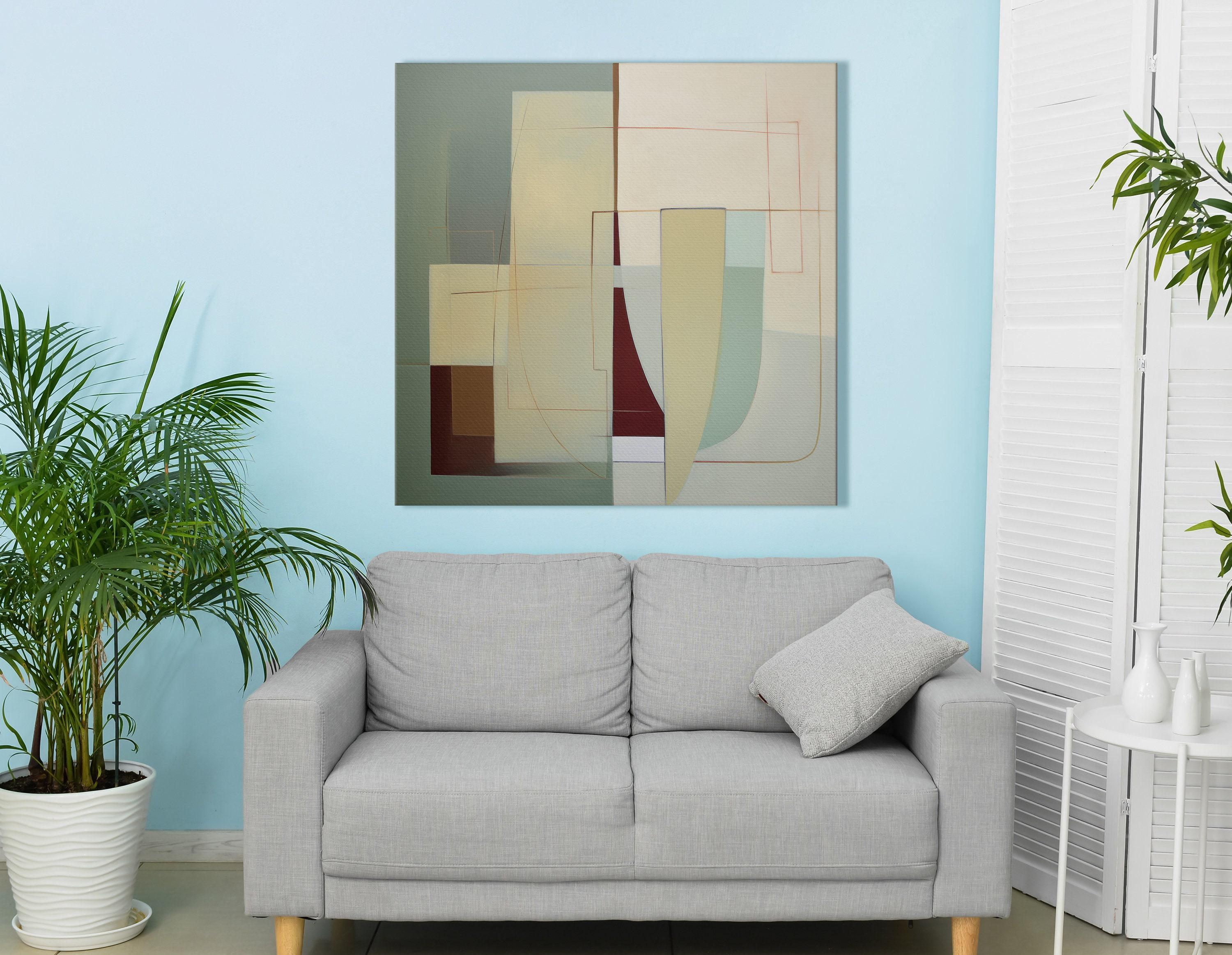 A framed abstract geometric composition combines muted sage and terracotta blocks with cream and burgundy lines in a balanced, mid-century style