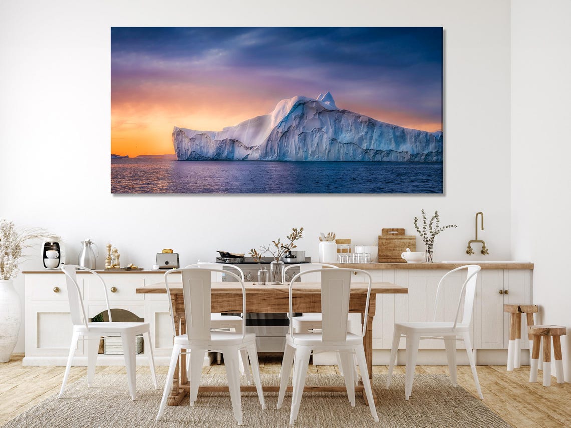 Room mockup showing a blue sofa with three panels of polar glacier artwork on the wall
