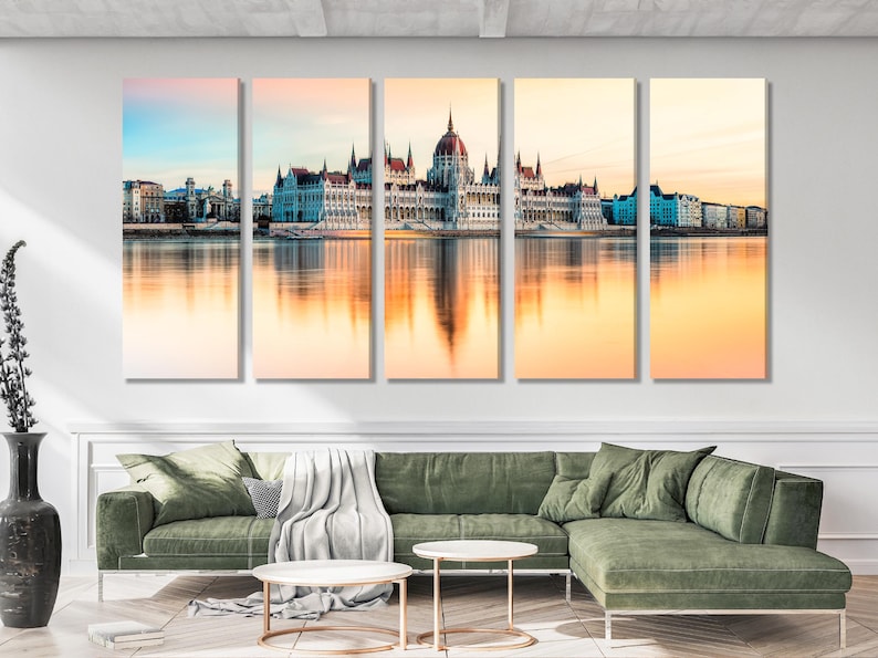 Sunset cityscape skyline with ornate towers and mirrored water reflections